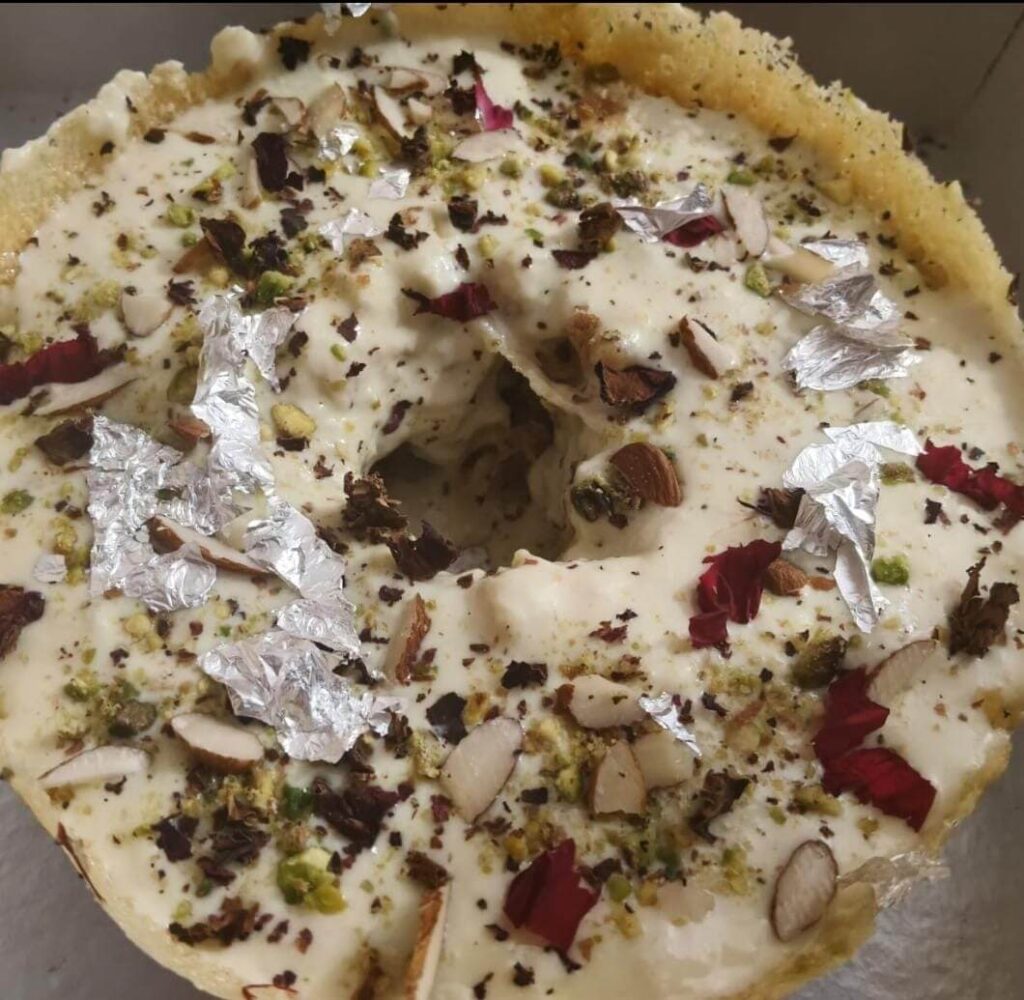 Fresh Malai Ghevar with delicious rabdi on top served by all-rounder chatore