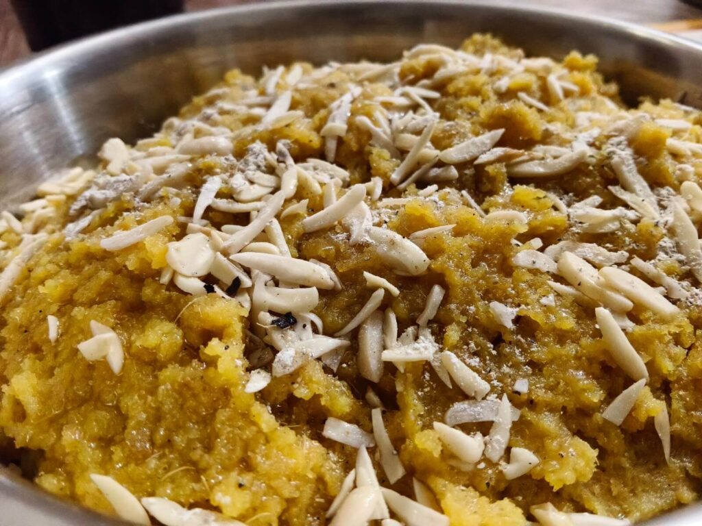 Desi ghee moong ki Dal ka halwa with almond slices on top