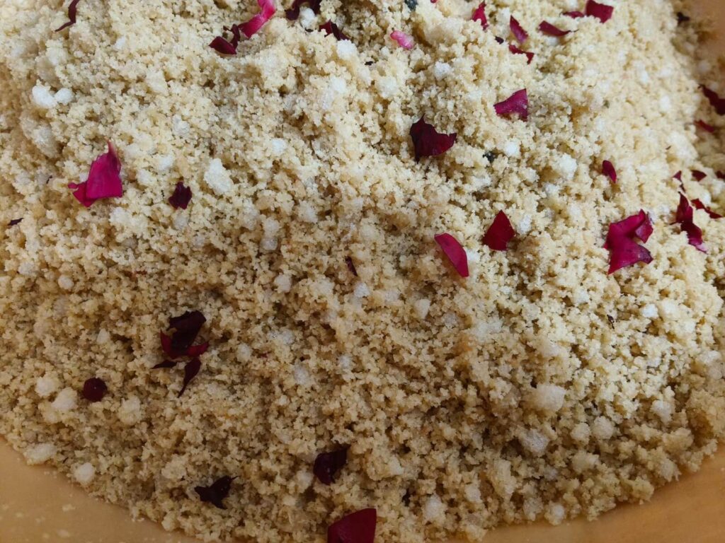 Authentic Rajasthani Churma made with desi ghee and topped with rose petals for a rich traditional taste.